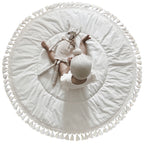 Rond speelkleed ecru met kwastjes
